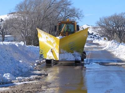 Snow plow clearing roads in Boise City