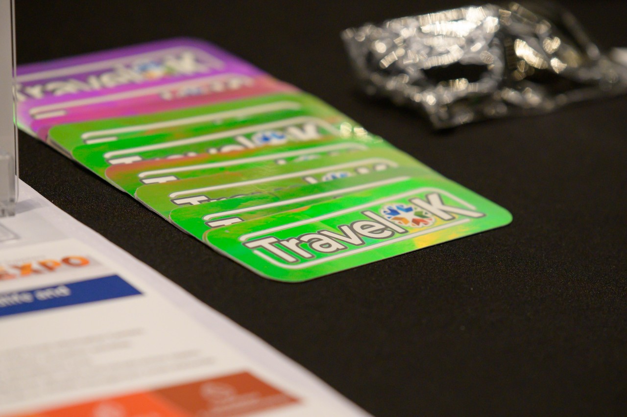 Holographic TravelOK stickers at the Tourism, Wildlife and Heritage cabinet booth.
