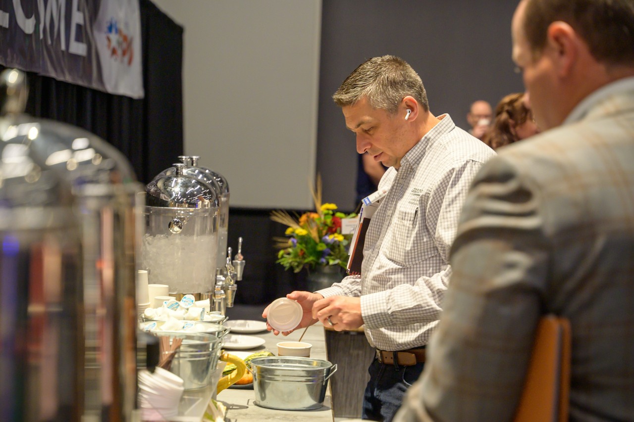 Attendees getting drinks from the Expo coffee bar.