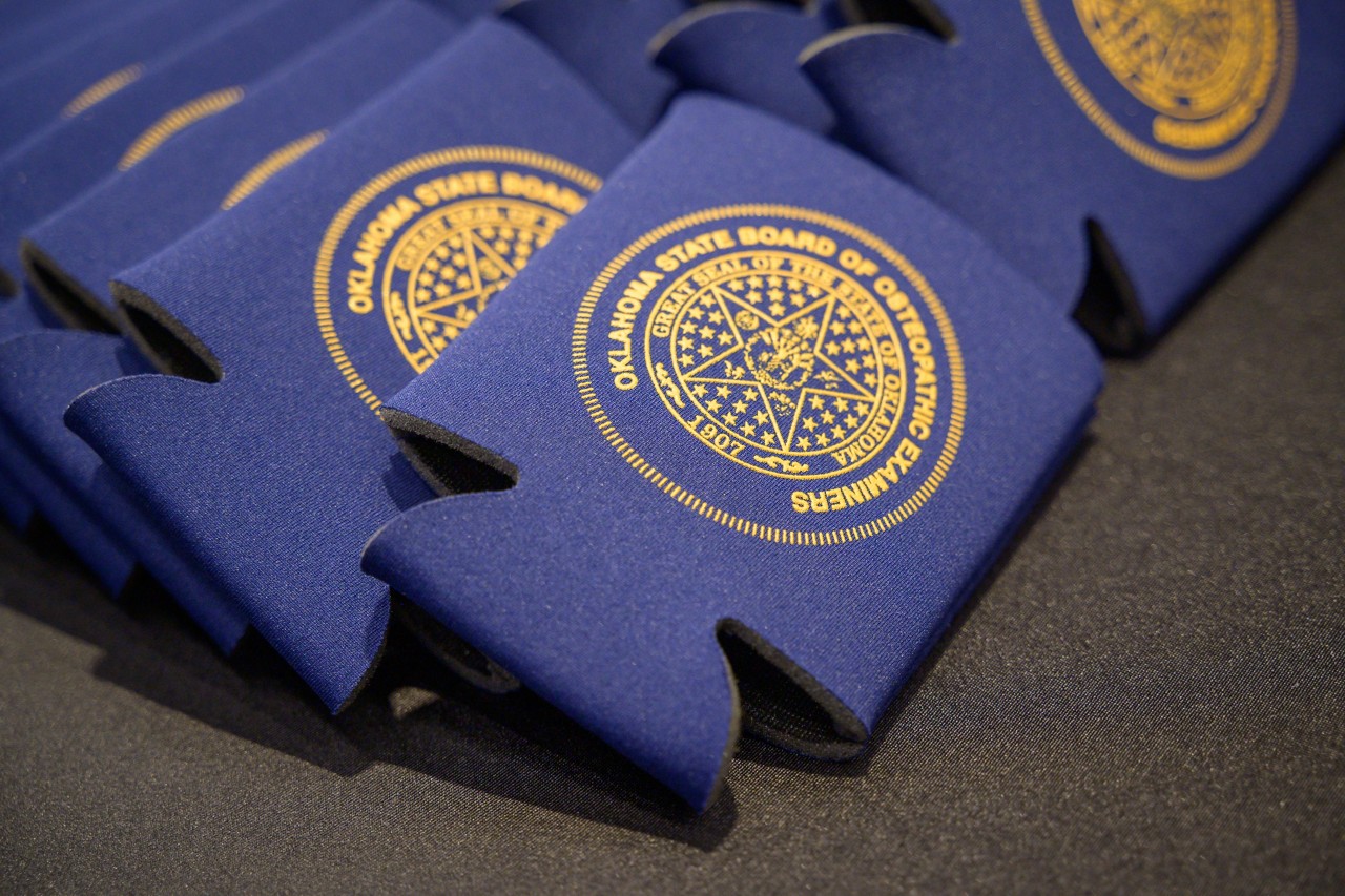 Navy blue drink koozies from the Board of Osteopathic Examiners at the Licensing and Regulation booth.