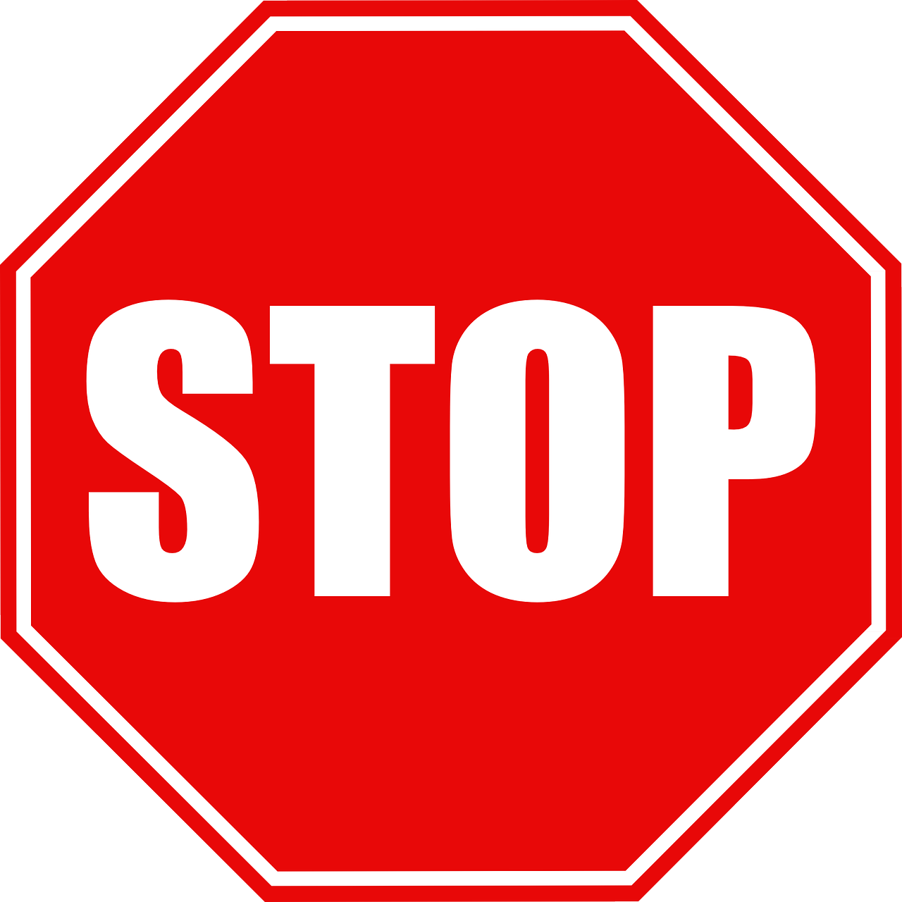 Red stop sign with text STOP