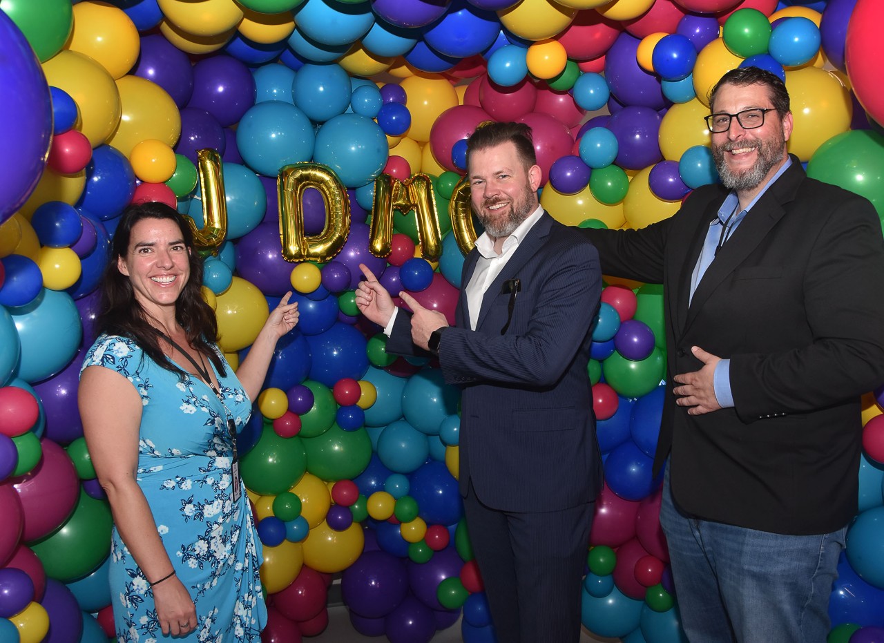 GMO team points to JDMC balloon wall