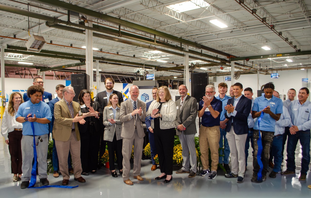 State leaders, students and staff celebrate the grand opening with a ceremonial ribbon cutting