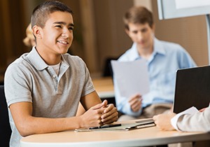 High school student being interviewd by college advisor or recruiter