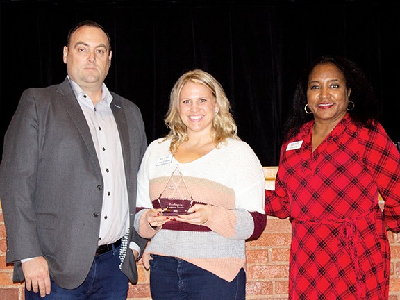 Kristye O'Mealey, center, STEM program specialist, received the Excellence in Customer Service Award. With her is State Board of Career and Technology Education board member Edward Hilliary Jr., left, and Oklahoma CareerTech Deputy State Director Cori Gray.