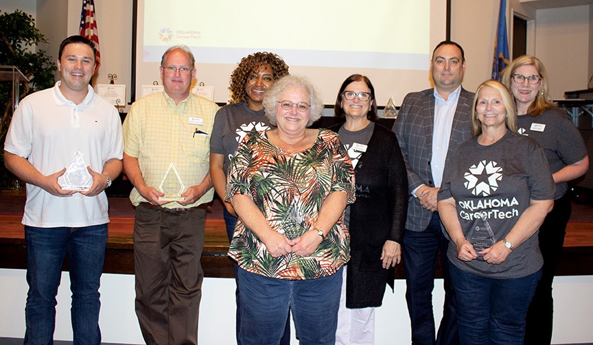 Receiving Leadership in Achieving Excellence awards were Debbie Hamble, Karen Hart, Trevor Lucas, Becki Foster, Cori Gray and Justin Lockwood. Pictured are, from left, Lucas; Lockwood; Gray; Hamble; Interim State Director Lee Denney; Edward Hilliary, State Board of Career and Technology Education member; Hart; and Foster.