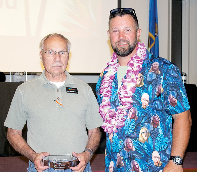 Jerry Greenwood, left, received a Spotlight Award for his work in the Printing, Distribution and Client Services division at Oklahoma CareerTech. With him is State Director Brent Haken.
