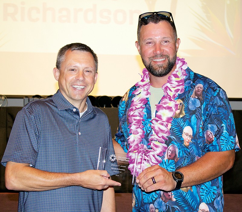 Barrett Richardson, left, received a Spotlight Award for his work serving students and building industry and educational partnerships in the Oklahoma CareerTech Skills Centers. With him is State Director Brent Haken.