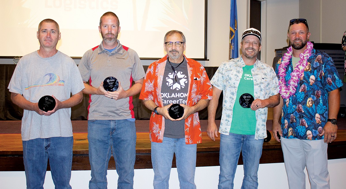 The Facility and Logistic Services division received a Spotlight Award for its work helping the Agricultural Education division quickly set up a conference room for teacher training. Pictured are, from left, Richard Curtis, Brian Preston, Robin Herrod, Brian Bates and State Director Brent Haken. Not pictured are team members Renae Lomenick, Robert Berkenbile, Robert Bergbower, Allen Bateson and Susan Benson.