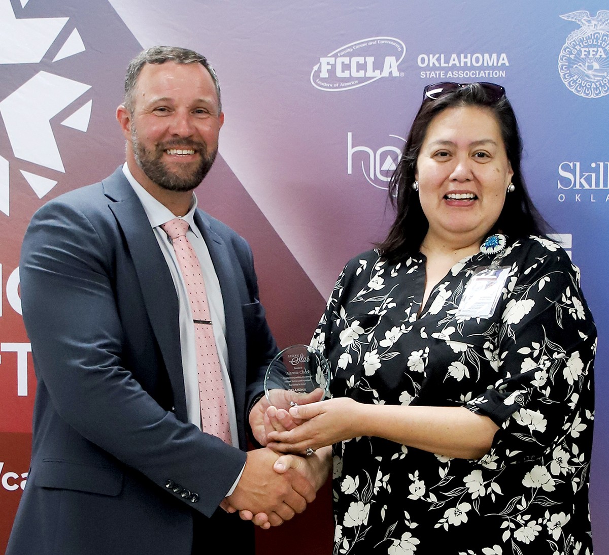 Maretta Cheek, financial services staff accountant at ODCTE, received a Rising Star Award at the 2025 spring state staff meeting. With her is CareerTech State Director Brent Haken.