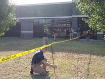 person marking outdoor area of a criminal investigation