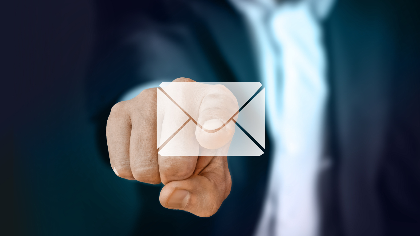 Man pointing a the screen, touching an email icon signifying an email notification