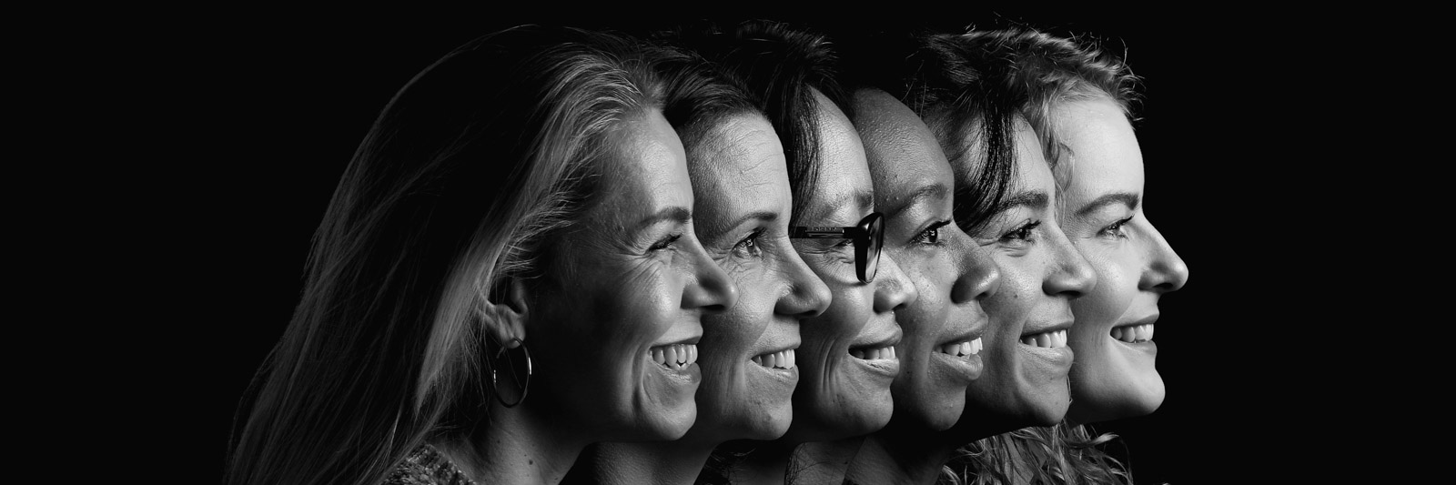 A black and white picture of group of women depicting the history of women