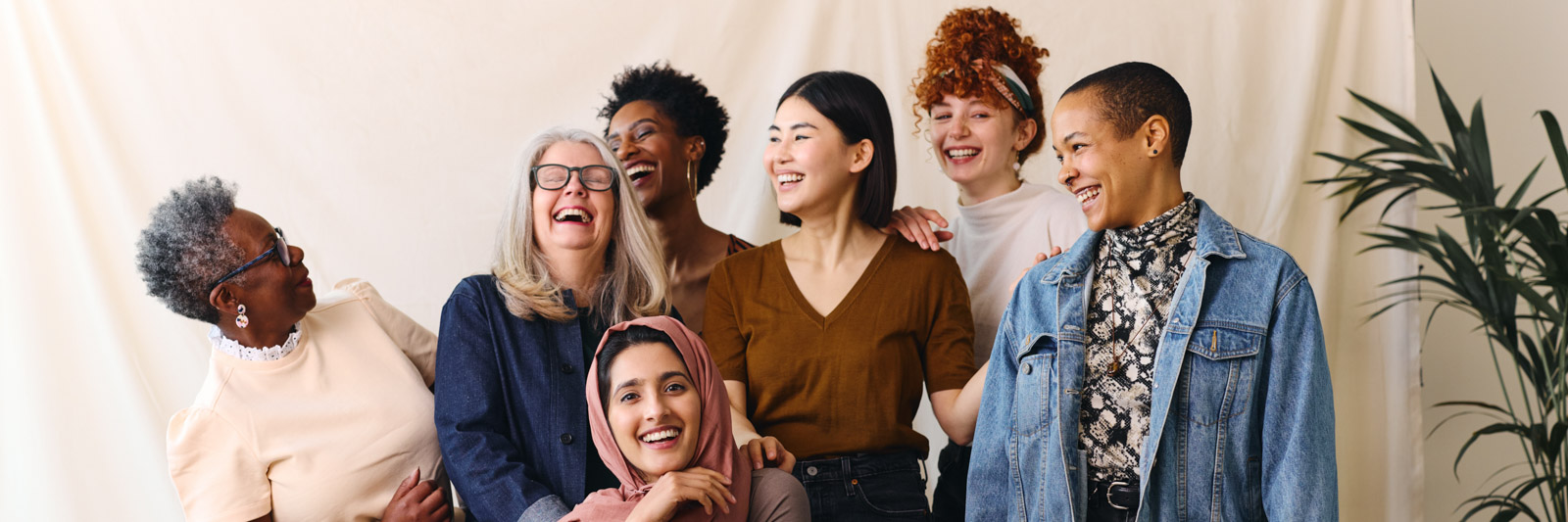 Portrait of cheerful mixed age range multi-ethnic women celebrating International Women's Day