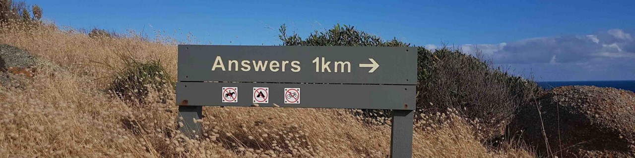 Road Sign along grassy bank