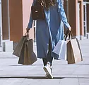 Shopper walking with bags.