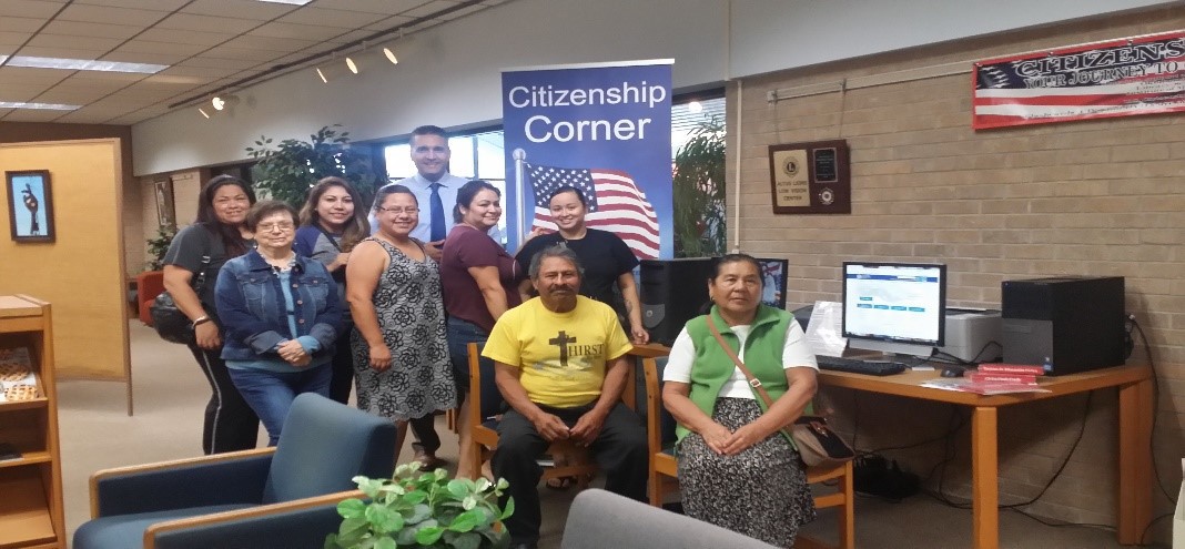 Family celebrating citizenship at the library
