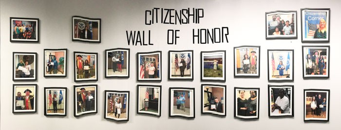 Citizenship Wall of Honor with images of people gaining their citizenship