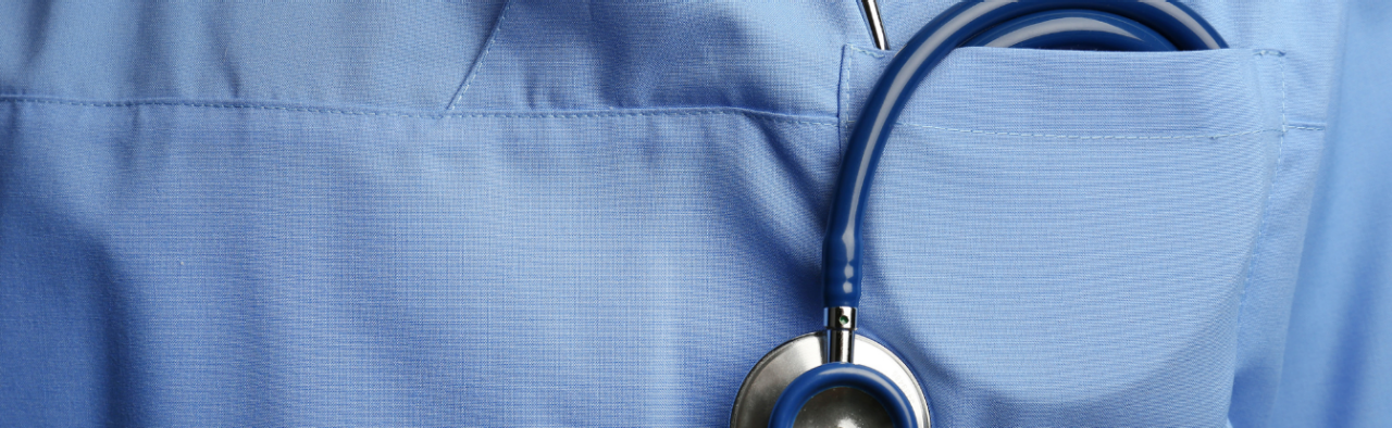 Nurse with a stethoscope in her scrubs pocket.