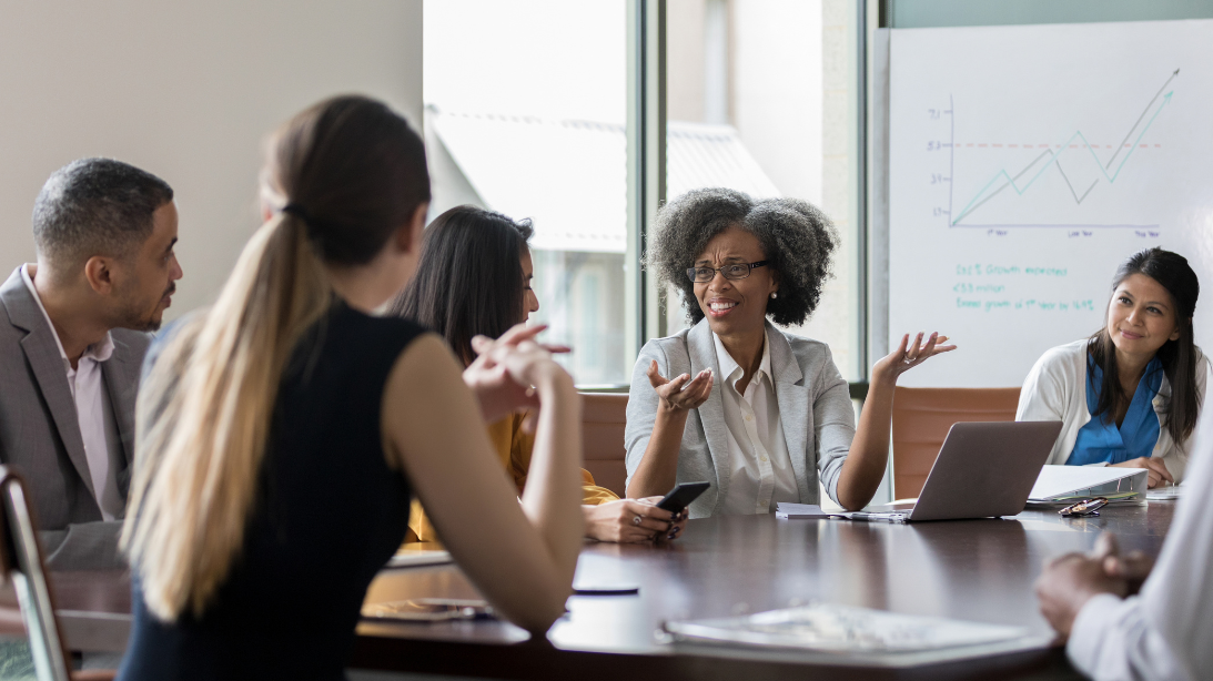 Board members discussing a topic at a table
