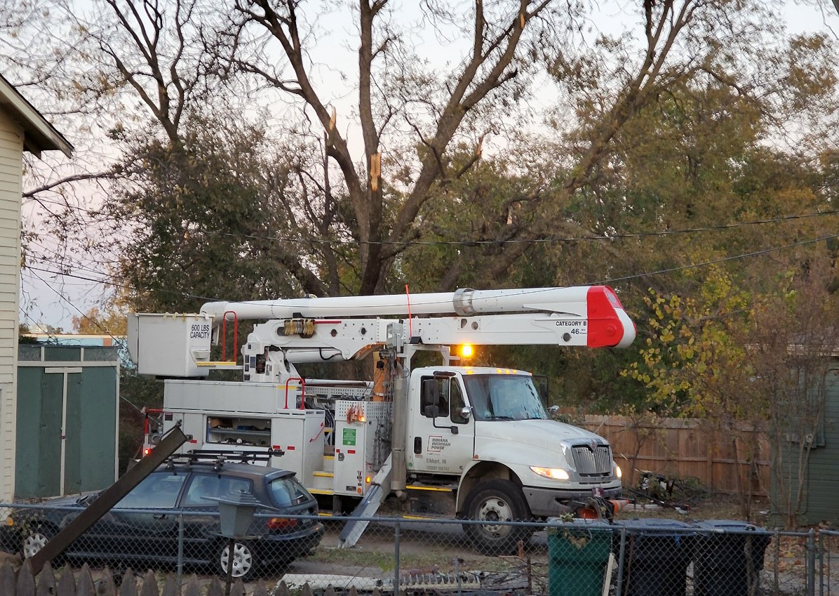 White utility truck in backyard
