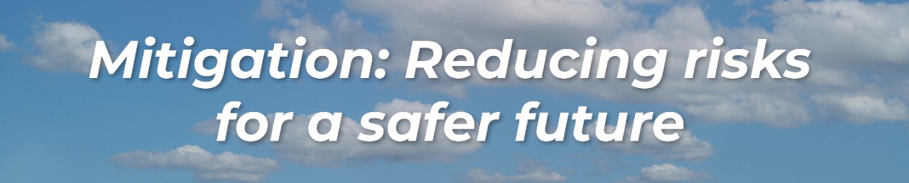 Mitigation: Reducing risks for a safer future. Blue sky with cloud background. 
