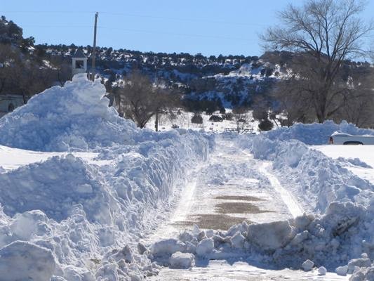 Snow drifts on side of road in Boise City