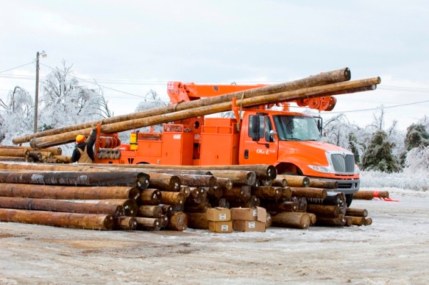 Checotah, Oklahoma OGE truck pickup new poles to install.