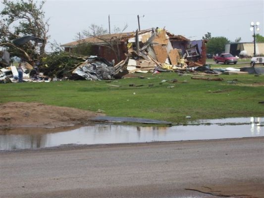Debris surrounding damaged structure.