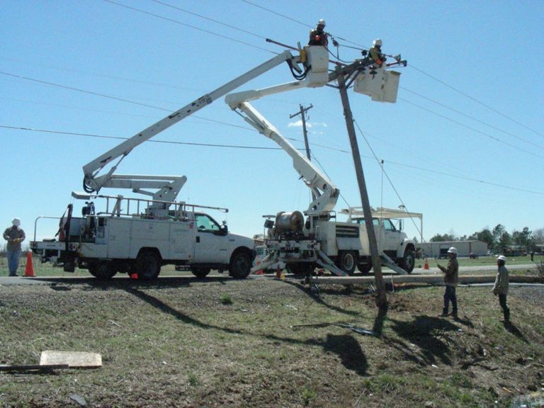 Electricity crews working on power lines. 
