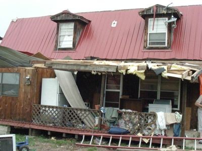 Damaged front porch of home.
