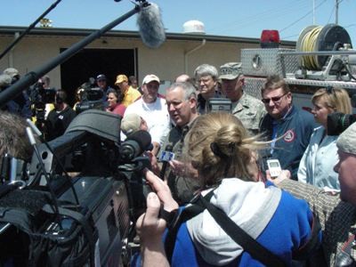 Governor Henry speaking at press conference.