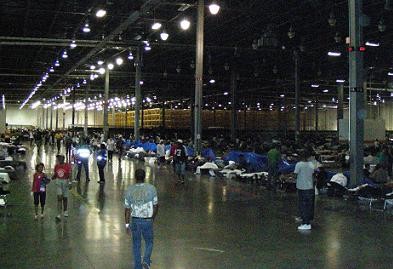 Hurrican Gustav shelter with people on cots, walking around and more. 