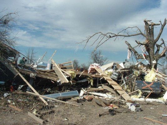 an unrecognizable building or home destroyed by a tornado.