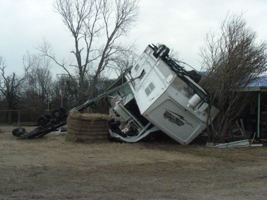 A RV flipped upside down.