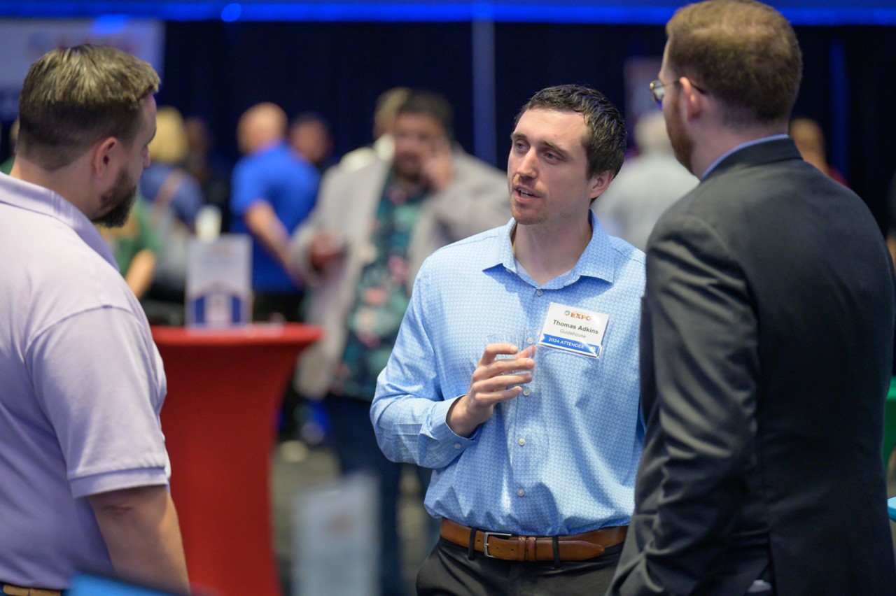 Three attendees networking