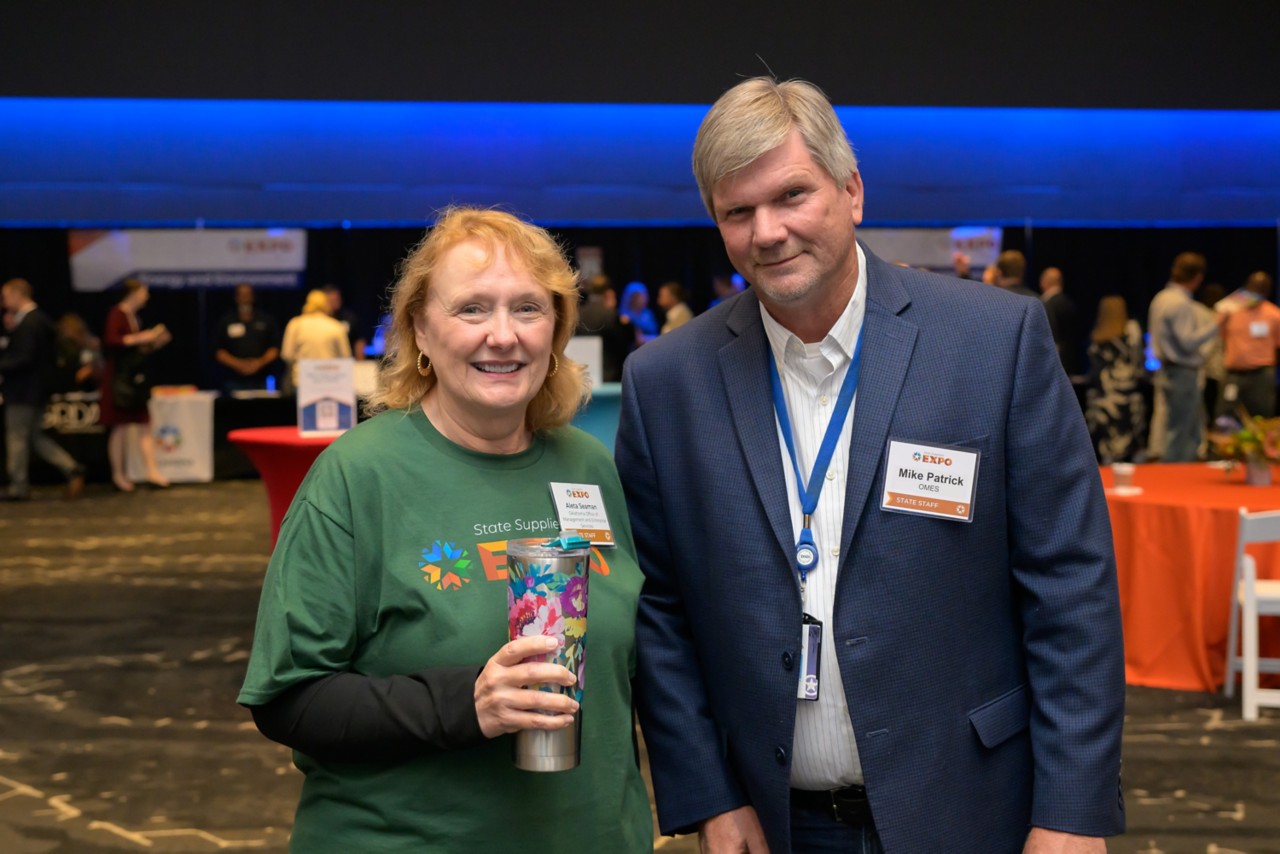 Two employees smiling together