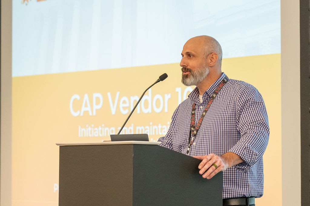 OMES CAM Administrator Nathan Wald speaks at podium during Construction and Properties breakout session