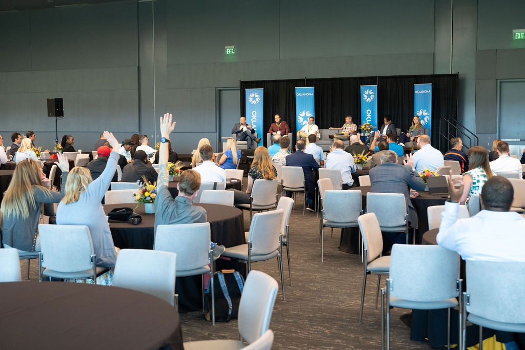 Attendees raise their hands at the Cybersecurity in State Government breakout session