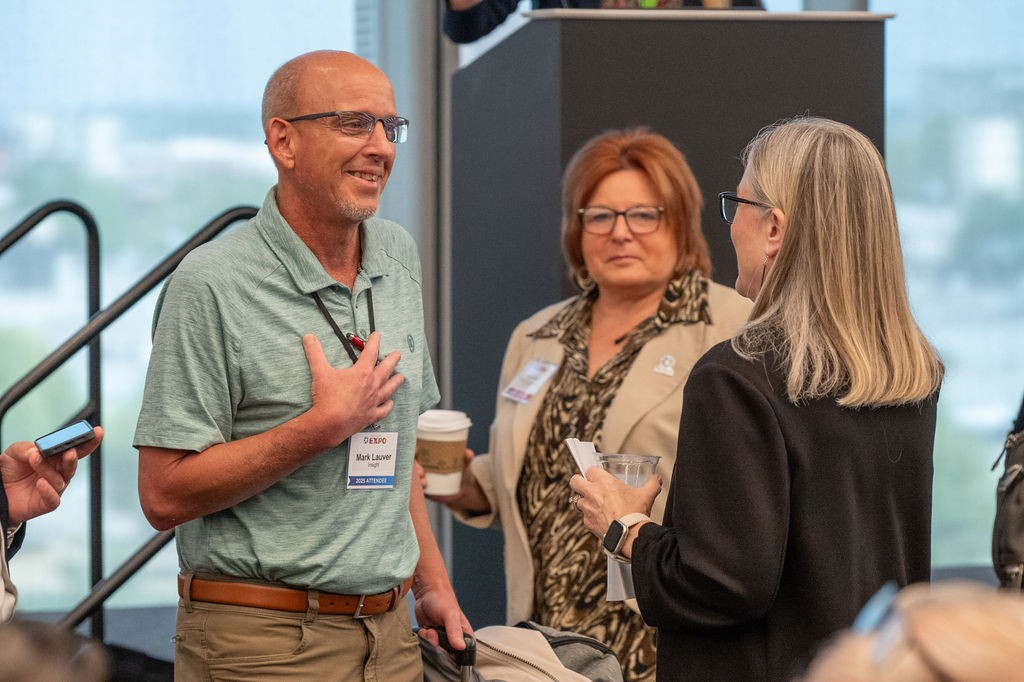 Supplier attendee talks to Central Purchasing breakout speakers