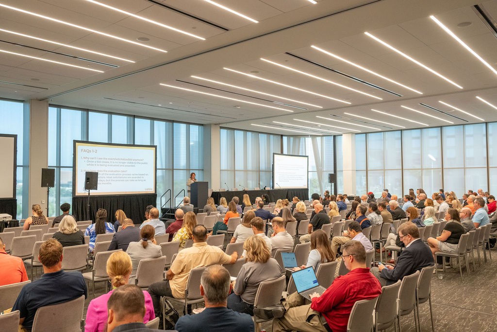 Audience listening to presenters during the Navigating the State Bidding Process breakout session