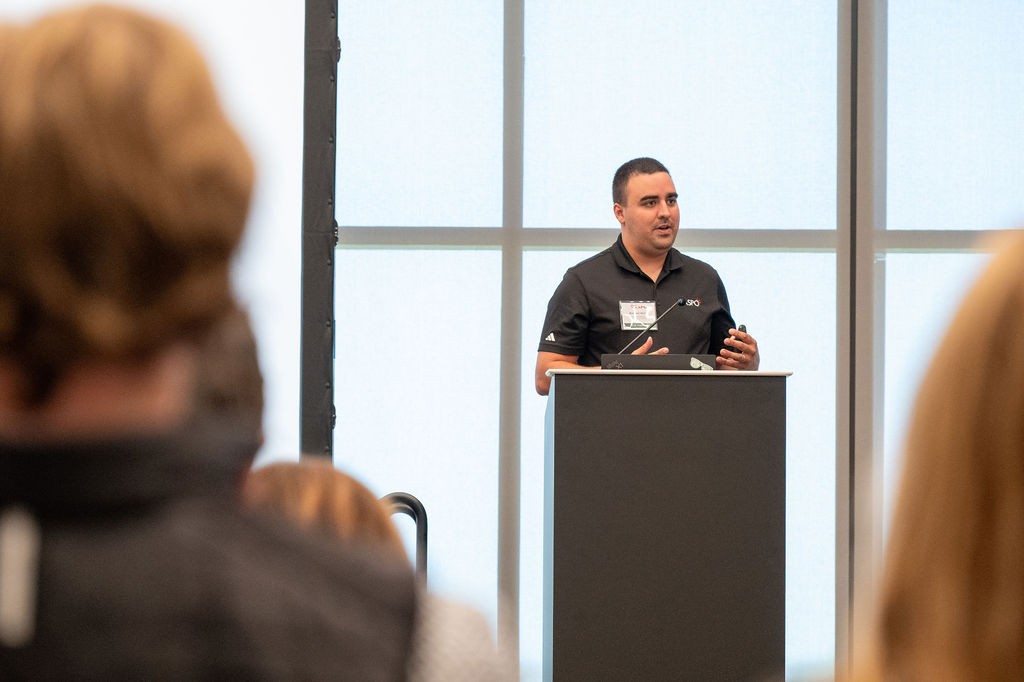 NASPO Cooperative Portfolio Manager Brandon Martin speaks at podium during National Cooperative Opportunities breakout session