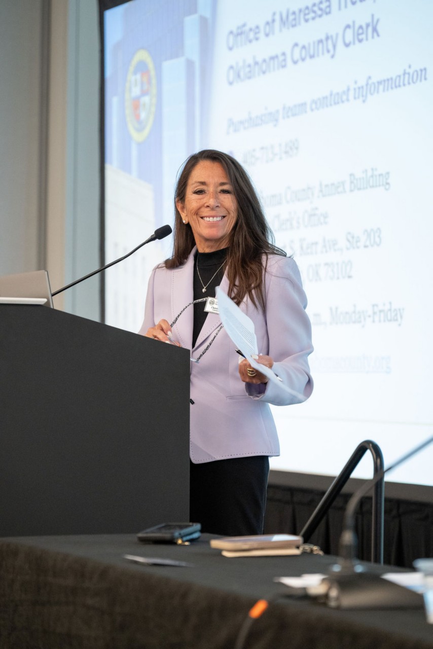 Oklahoma County Director of Communications Cherokee Ballard smiles at podium during Doing Business with Oklahoma County breakout session