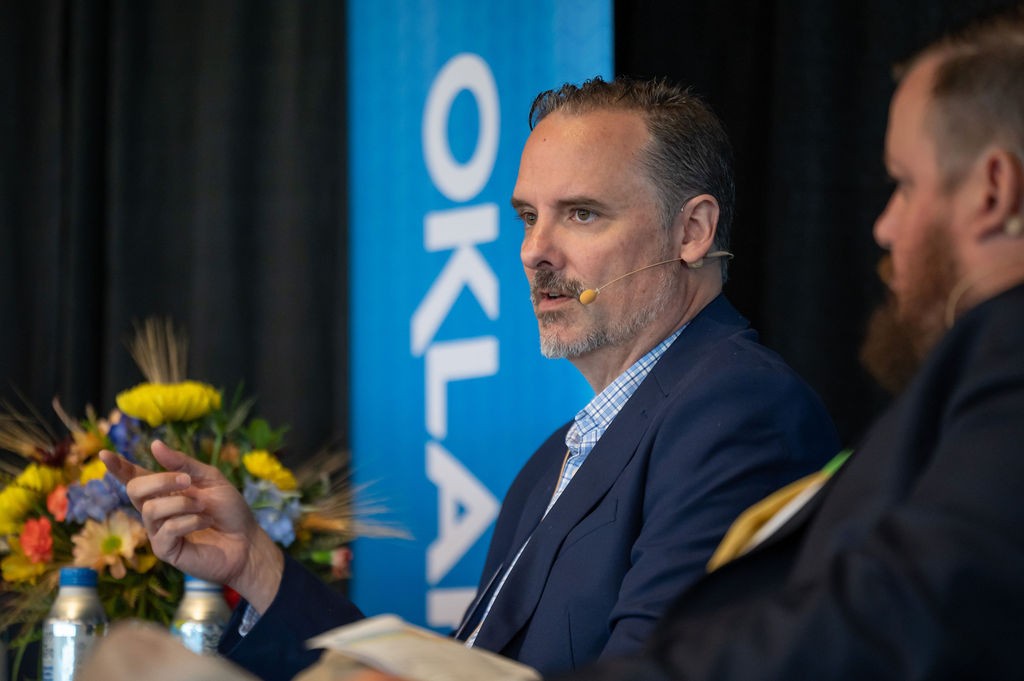 Side angle of Transportation Chief Technology Officer Tab Pierce speaking during luncheon panel