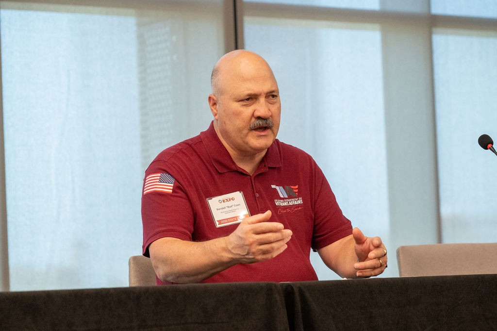 ODVA Education Programs Admin Randall "Bud" Coon seated and speaking at the Veteran-owned Businesses breakout session