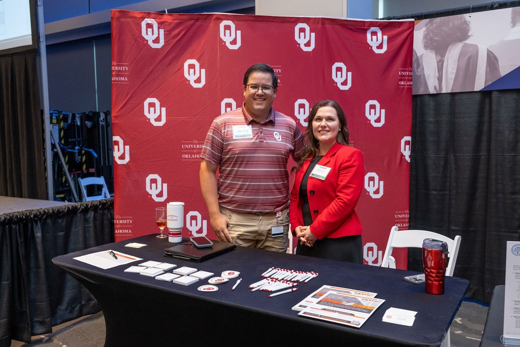 OU employees at the Higher Education booth