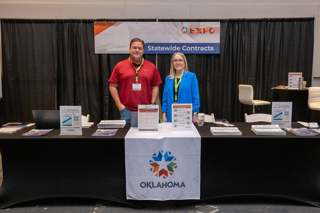 State staff smiling at Statewide Contracts booth