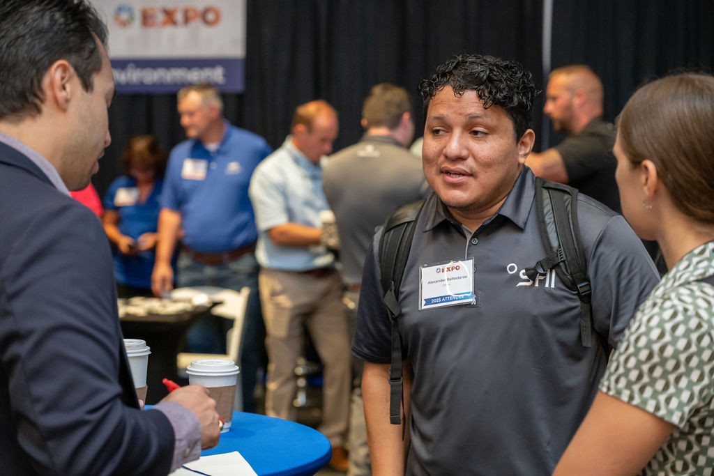 Three supplier attendees conversing