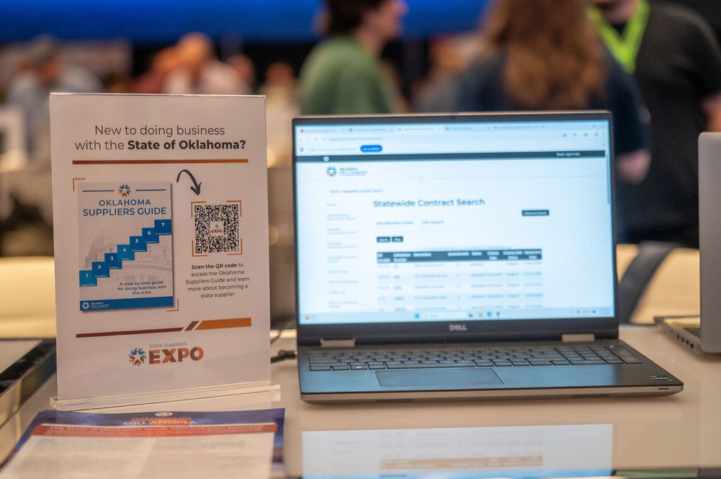 Flyer and laptop at Supplier Registration booth