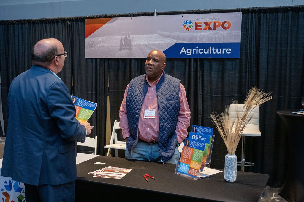 ODAFF employee talks to supplier at Agriculture booth